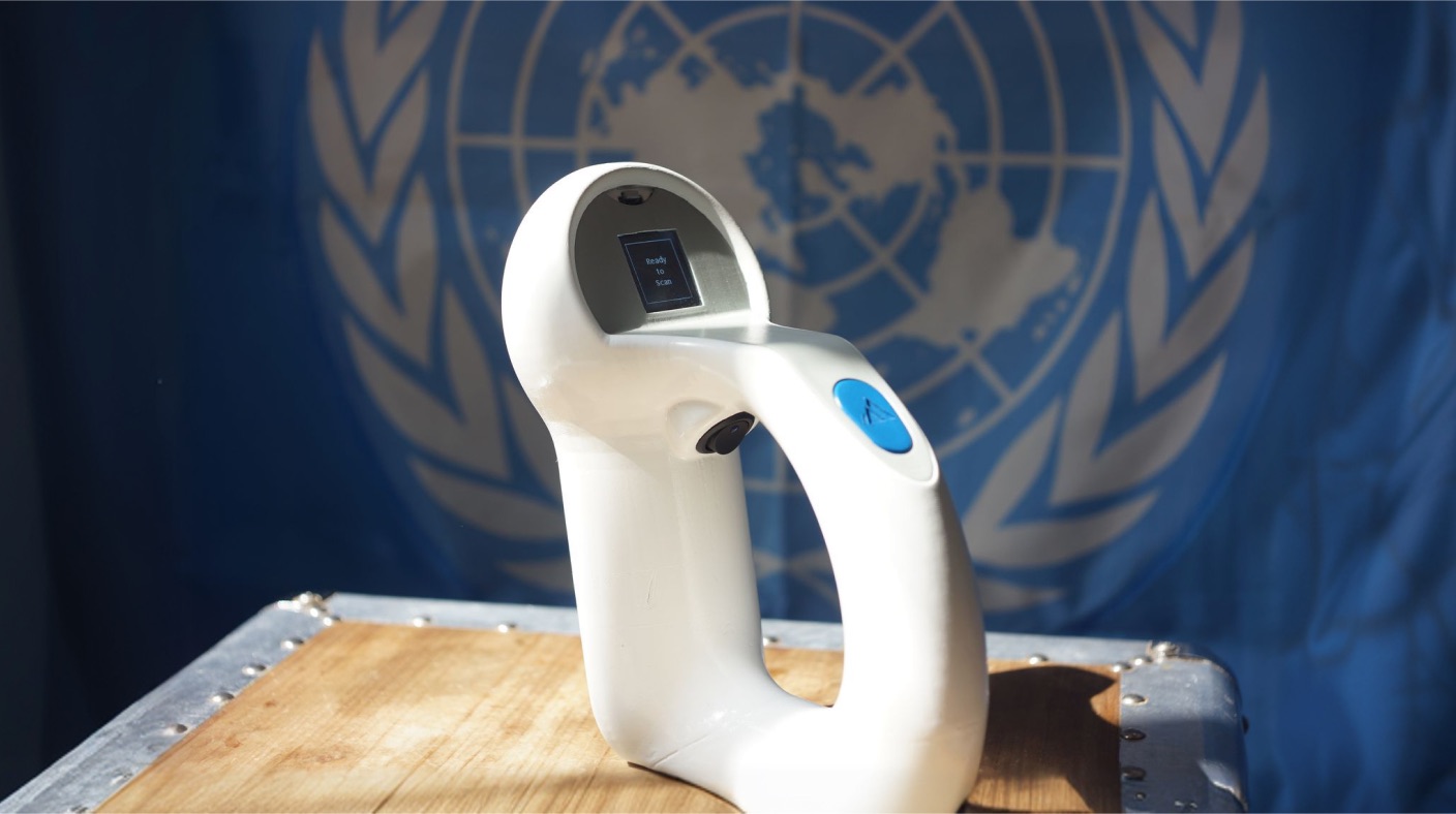 The Theia thermometer in front of a United Nations flag